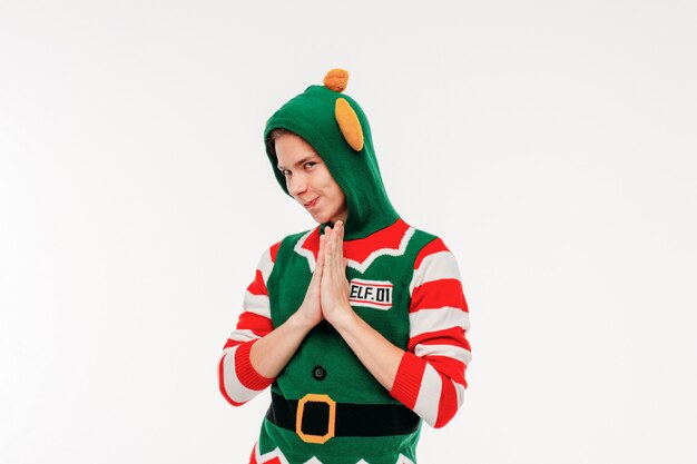 Attractive young men teenager in elf costume on white background