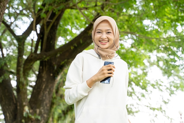 Attractive young muslim woman running outdoor during ramadan fasting