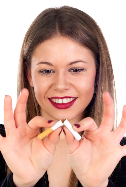 Attractive young woman breaking a cigar 