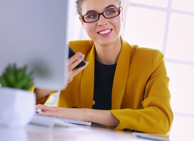attractive young woman checking her text messages on her mobile phone