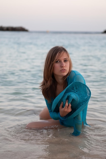 Attractive young woman in a coastal environment near the sea