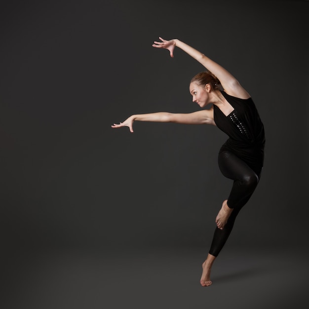 Attractive young woman dancing