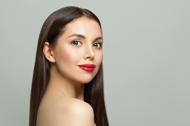 Attractive young woman face on white background