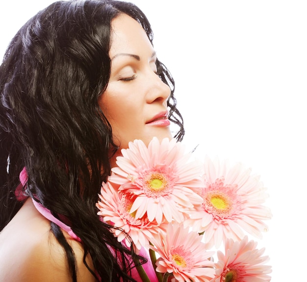 Attractive young woman face with flowers