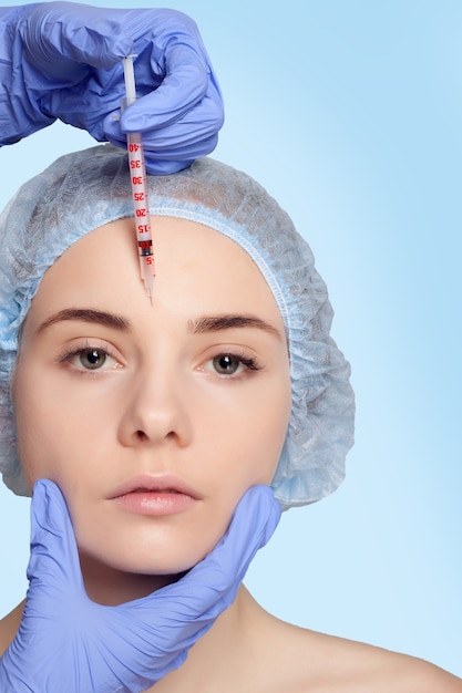 Attractive young woman gets cosmetic injection
