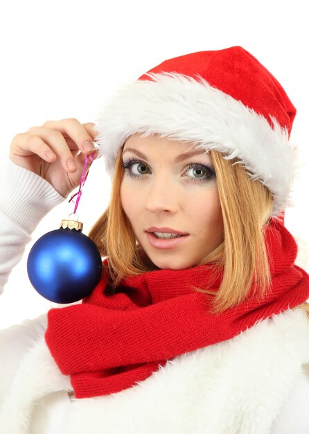 Attractive young woman holding Christmas ball isolated on white