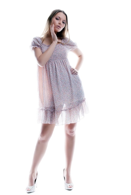 Attractive young woman posing in motley sarafan