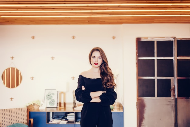 Attractive young woman posing in a room