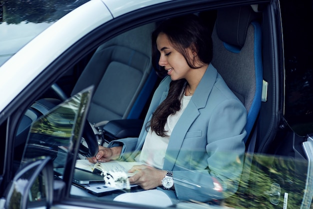 Attractive young woman taking a coffee break successful businesswoman with laptop notebook and