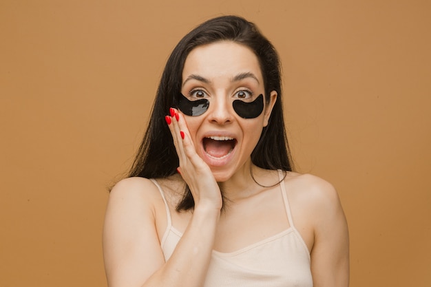 Attractive young woman in underwear surprised