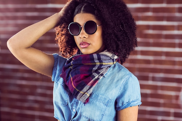 Attractive young woman wearing sunglasses