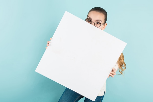 Attractive young woman with blank banner