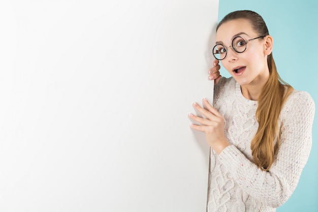 Attractive young woman with blank banner