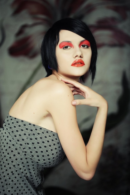 Attractive young woman with bright red make up