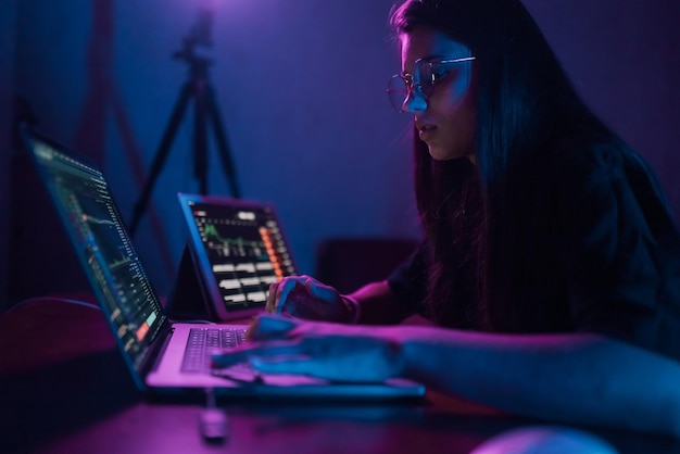 Attractive young woman working in home at night