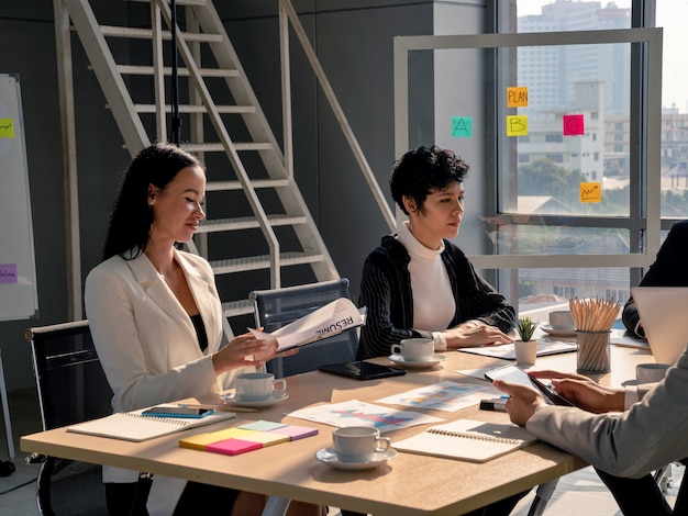 Atttractive business women  listening to presentation with team working in meeting room at the office,  business analysis and strategy concept, woman leader