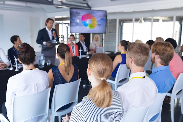 audience listening male speaker in a business conference