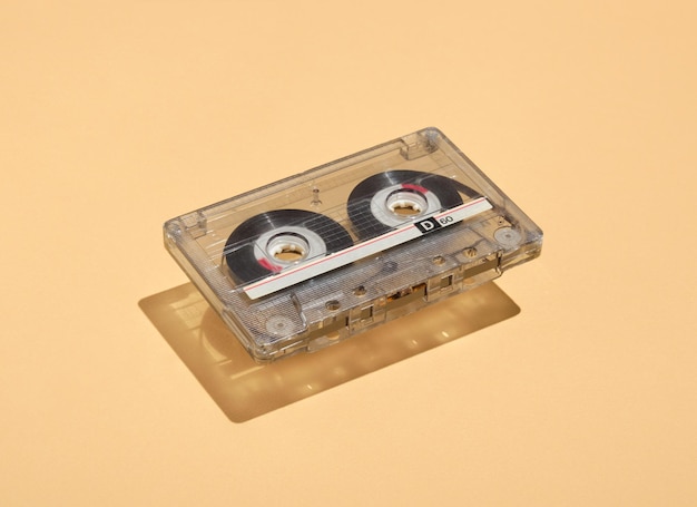 Audio cassette float above the surface. Scene of music and parties with friends. Nostalgia for retro style.