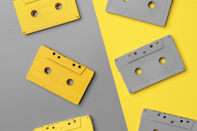 Audio cassettes on gray and yellow