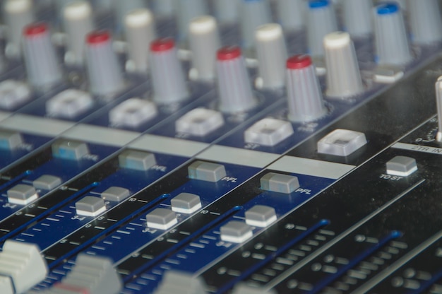 The audio equipment, control panel of digital studio mixer. Close-up, selected focus