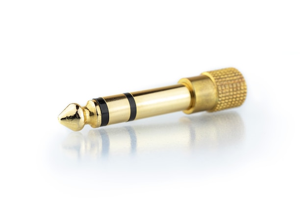 Audio jack plug converter from 3.5mm to 6.3mm isolated on white background, photo with reflection