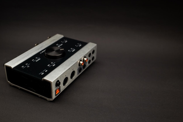 Audio mixer on a black background a subject shot of musical instruments