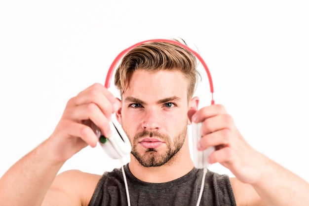 Audio training for motivation Listen music Professional software and devices Entertainment concept Man handsome guy hold headphones Music taste Check out music album Music as daily therapy