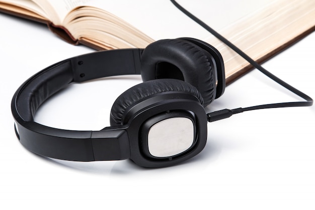 Audiobooks, headphones on book pile