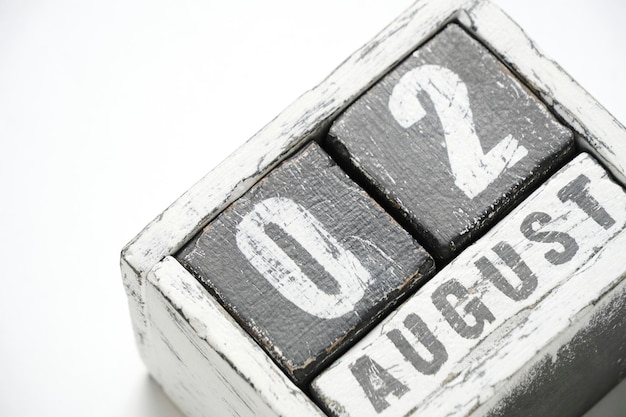 August 02 wooden calendar with cubes on a white background