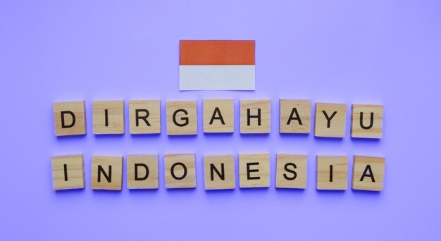 August 17 Indonesia Independence Day flag of Indonesia minimalistic banner with the inscription in wooden letters Dirgahayu Indonesia