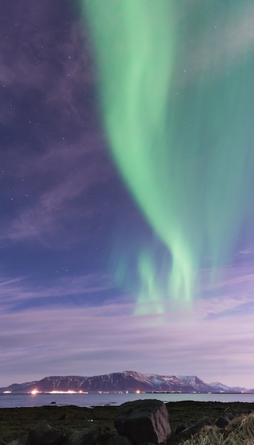 Aurora Borealis over a black sand beach