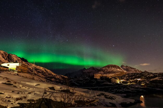 Aurora borealis over dark the mountains in Lofoten Islands