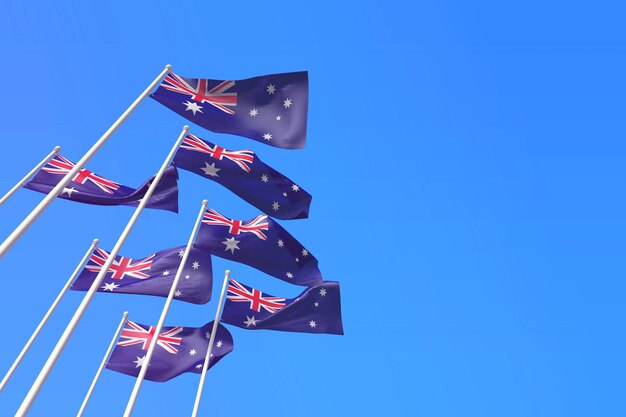 Photo australia flags waving in the wind against a blue sky d rendering