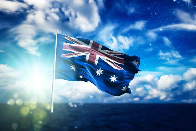 Australia national flag waving in beautiful clouds