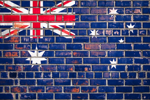 Photo australian flag on a grunge brick background