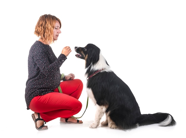 australian shepherd and woman