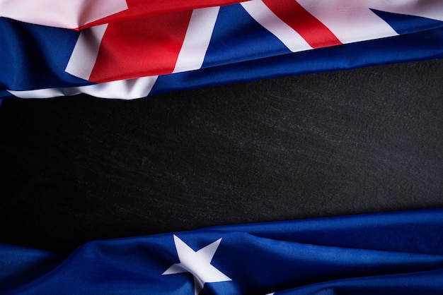 Australië dag concept. Australische vlag tegen een schoolbordachtergrond