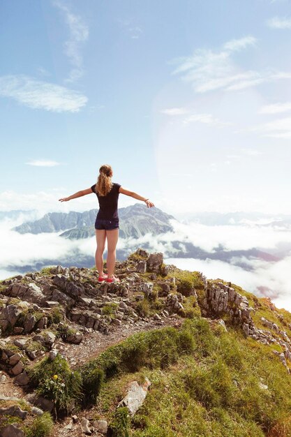 Austria, South Tyrol, female hiker, teenage girl arms outstretched