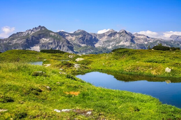 Austria, Styria, Murau district, Alps and lake in the foreground