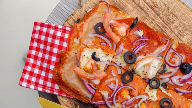 Authentic italian thin delicious pizza with mozarella in selective focus