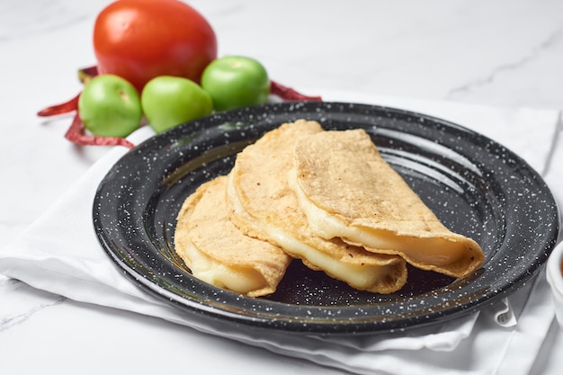 Authentic Mexican quesadillas made with corn tortillas filled with cheese