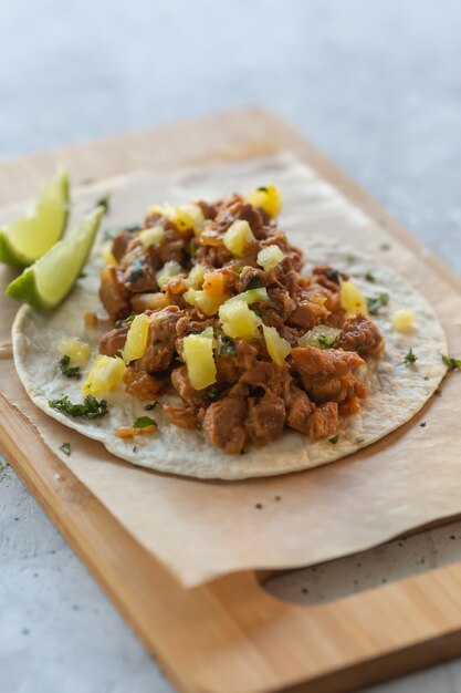 Authentic mexican tacos with pork meat and vegetables