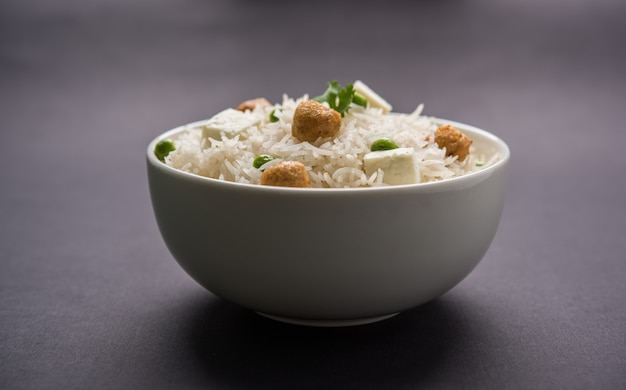 authentic paneer or soya bean or green peas pulav or vegetables rice or veg biryani with paneer cubes and soya chunk, selective focus