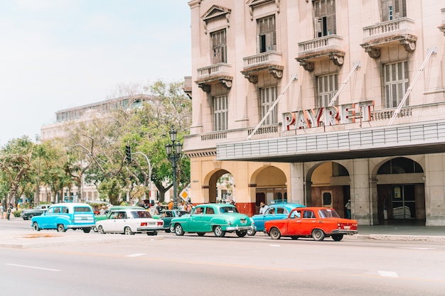 Authentic view of a street of Old Havana with old buildings and cars