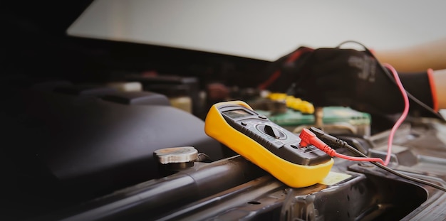 Auto mechanic Check batteries repair and replace engine parts