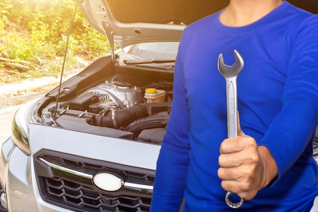 Photo auto mechanic or driver checks steering and gear system and start system before driving at service stationchange and repair before drive xa