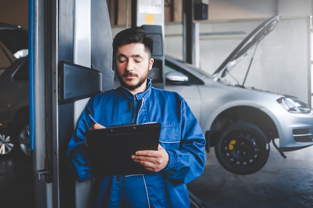 auto mechanic repairing cars in the service garage