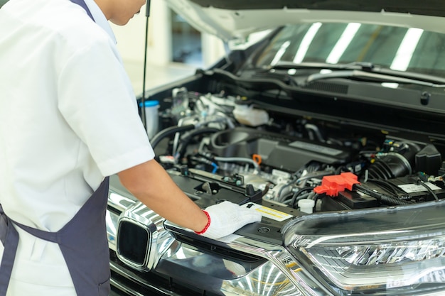 Auto mechanic working in garage, Car Repair Service center.