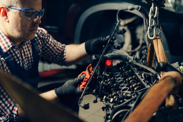 Auto mechanic working in garage Repair service