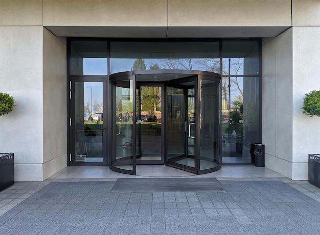 Automatic modern black rotating doors office mockup